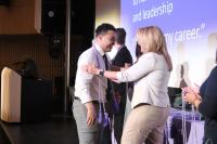 Student receiving tassels at Sigma Induction Ceremony